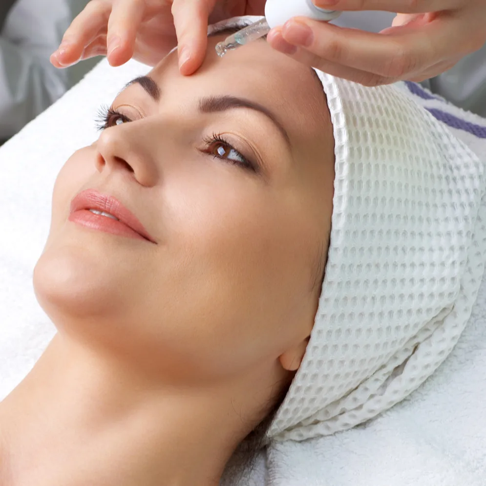 A patient prepared for a PRP facial treatment